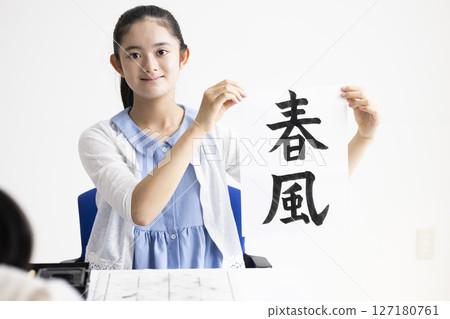 Children doing calligraphy Children doing calligraphy 127180761