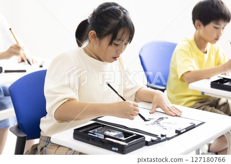 Children doing calligraphy Children doing calligraphy 127180766