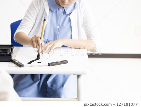 Children doing calligraphy Children doing calligraphy 127181077
