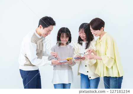 Parents and children showing and using smartphones on white background 127181234