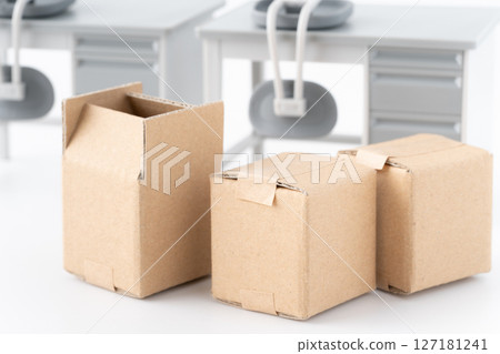 Miniature desks, chairs and cardboard boxes for office relocation Miniature desks, chairs and cardboard boxes for office relocation 127181241