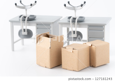 Miniature desks, chairs and cardboard boxes for office relocation 127181243