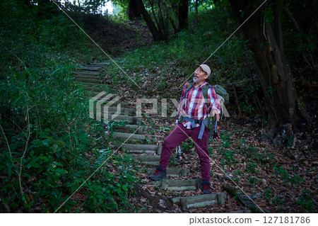 Hiking, mountain climbing, senior camper, dusk, solo camping, senior Hiking, mountain climbing, senior camper, dusk, solo camping, senior 127181786
