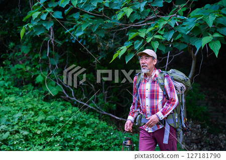 Hiking, mountain climbing, senior camper, dusk, solo camping, senior Hiking, mountain climbing, senior camper, dusk, solo camping, senior 127181790