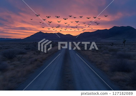 Drone Swarm Over Desert Road at Sunrise 127182089