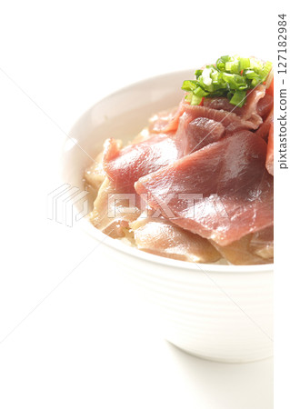 Two-tone bowl of red tuna and medium fatty tuna photographed on a white background 127182984