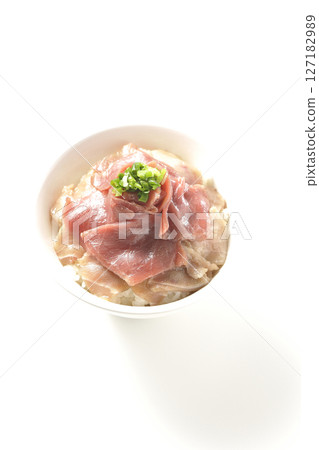 Two-tone bowl of red tuna and medium fatty tuna photographed on a white background Two-tone bowl of red tuna and medium fatty tuna photographed on a white background 127182989