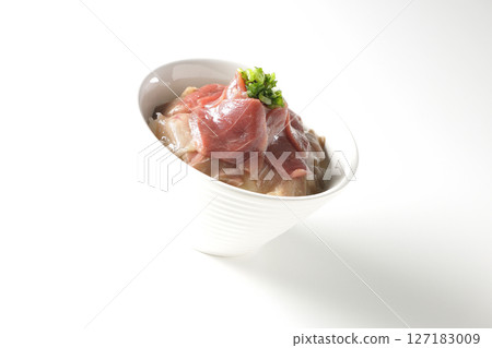 Two-tone bowl of red tuna and medium fatty tuna photographed on a white background 127183009