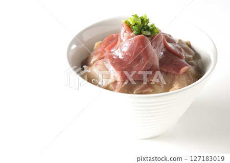 Two-tone bowl of red tuna and medium fatty tuna photographed on a white background 127183019