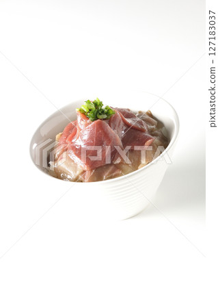 Two-tone bowl of red tuna and medium fatty tuna photographed on a white background 127183037