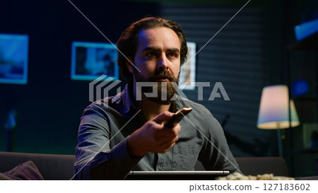 Man at home scared by troubling events broadcasted on TV, rushing to leave house. Person appalled by imminent danger upsetting breaking news story on TV, running out of fear, camera A Man at home scared by troubling events broadcasted on TV, rushing to leave house. Person appalled by imminent danger upsetting breaking news story on TV, running out of fear, camera A 127183602