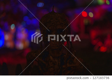 Terrifying Halloween Zombie Figure in Dark Spooky Lighting Terrifying Halloween Zombie Figure in Dark Spooky Lighting 127183736