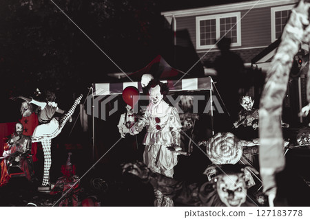 Creepy Halloween Clown Scene with Kissing Booth and Carnival Setup 127183778