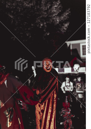 Creepy Halloween Clown Scene with Kissing Booth and Carnival Setup 127183792