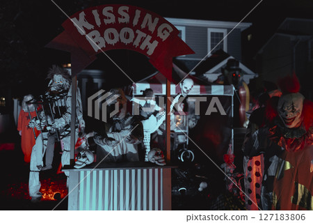 Creepy Halloween Clown Scene with Kissing Booth and Carnival Setup Creepy Halloween Clown Scene with Kissing Booth and Carnival Setup 127183806