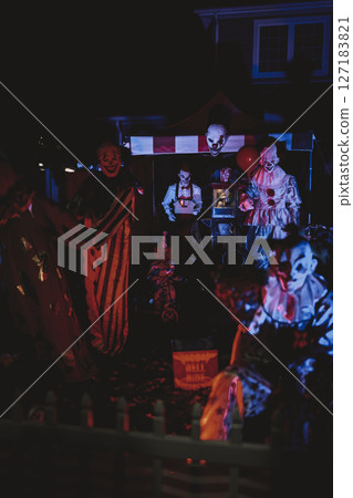 Creepy Halloween Clown Scene with Kissing Booth and Carnival Setup Creepy Halloween Clown Scene with Kissing Booth and Carnival Setup 127183821