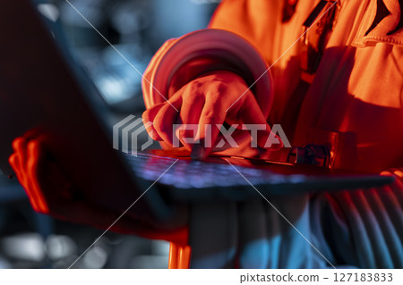 Close up of spaceship engineer typing on laptop, fixing security breach causing alarm to sound. Space station technician pressing notebook keys, repairing system failure triggering emergency lights 127183833