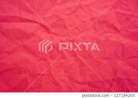 Full frame shot of crumpled red paper sheet texture and background. 127184203