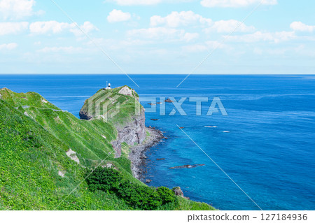 Shakotan Town, Hokkaido: Cape Kamui and Cape Kamui Lighthouse in summer with beautiful fresh greenery 127184936