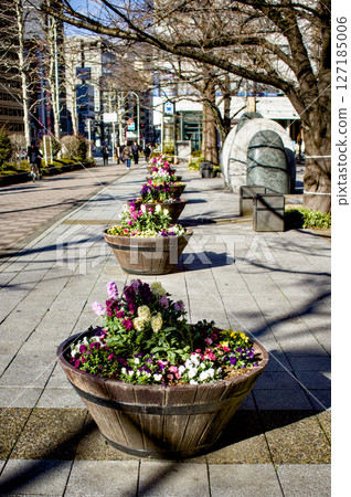 A scene of flower pots lining the street A scene of flower pots lining the street 127185006