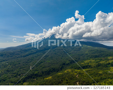 Beautiful skyline with clouds formation over the mountain in Camiguin Island. Philippines. Beautiful skyline with clouds formation over the mountain in Camiguin Island. Philippines. 127185143