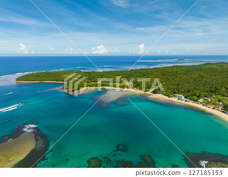 Tropical island and the deep blue sea surrounded. Mindanao, Philippines. Seascape: Summer and travel concept. 127185153
