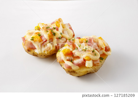 Potato boat gratin with bacon and boiled eggs Potato boat gratin with bacon and boiled eggs 127185209