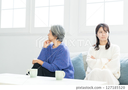Mother and daughter fighting Mother and daughter fighting 127185520