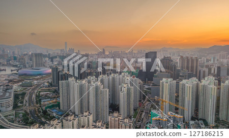 June 6 2025 Cityscape at Sunset Highlighting Skyscrapers and Distant Mountains 127186215