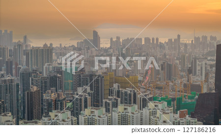June 6 2025 Cityscape at Sunset Highlighting Skyscrapers and Distant Mountains 127186216