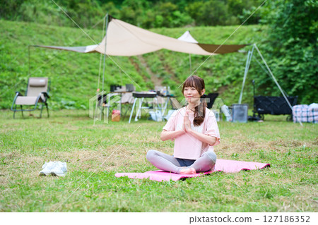 Yoga exercise stretching outdoor park middle-aged senior 127186352