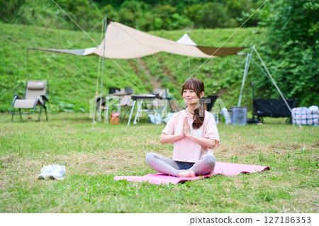 Yoga meditation exercise stretching outdoor park middle-aged senior 127186353