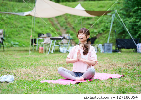 Yoga meditation exercise stretching outdoor park middle-aged senior 127186354