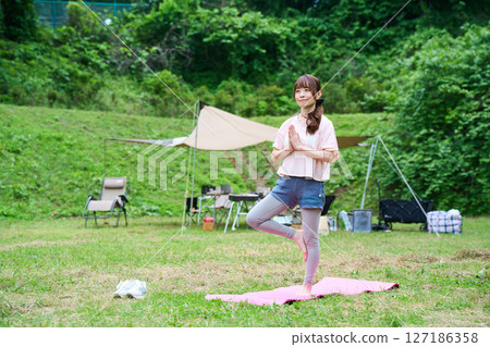 Yoga exercise stretching outdoor park middle-aged senior 127186358
