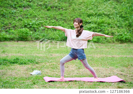 Yoga exercise stretching outdoor park middle-aged senior Yoga exercise stretching outdoor park middle-aged senior 127186366