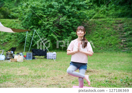 Yoga exercise stretching outdoor park middle-aged senior 127186369