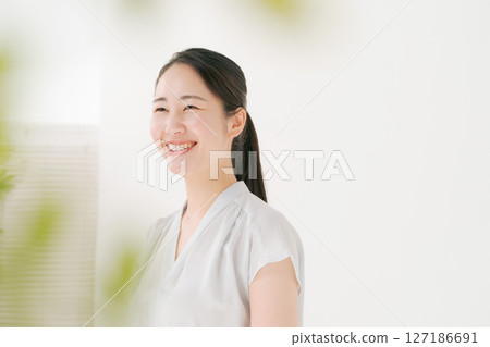 Portrait of a dark-haired woman 127186691