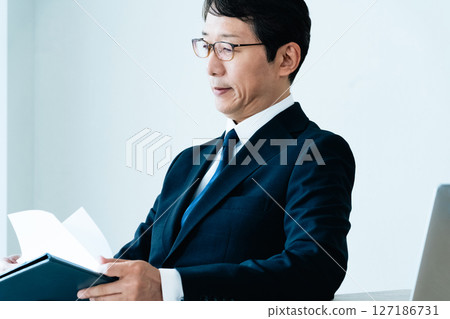 Businessmen checking materials 127186731