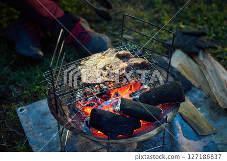 Solo camper eating steak Solo camp Senior Solo camper eating steak Solo camp Senior 127186837