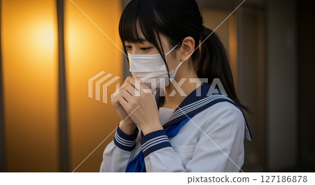 A high school girl wearing a sailor uniform and a ponytail, wearing a mask, in school after school 127186878