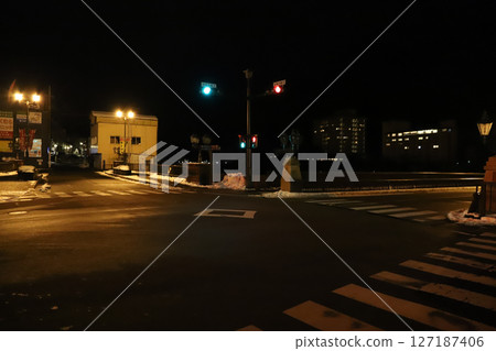 People waiting for the railroad crossing at night People waiting for the railroad crossing at night 127187406