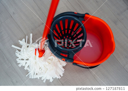 bucket for wet cleaning with moisture wringing and mop 127187811