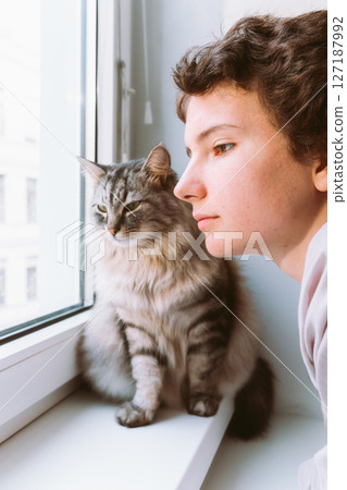 Portrait teenage girl and cat 127187992