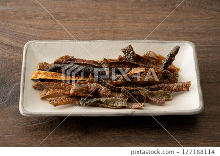 Salmon skin chips on a plate Salmon skin chips on a plate 127188114