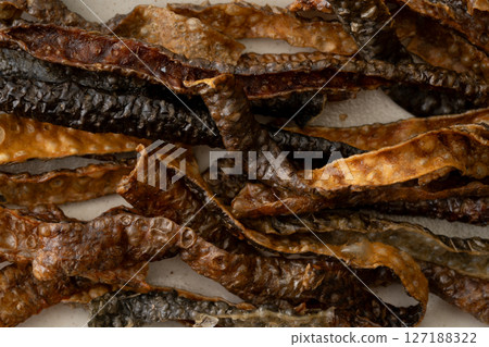 Close-up of salmon skin chips Close-up of salmon skin chips 127188322