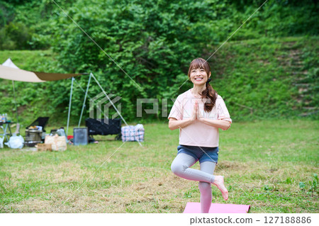 Yoga exercise stretching outdoor park middle-aged senior 127188886