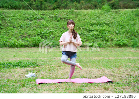 Yoga exercise stretching outdoor park middle-aged senior Yoga exercise stretching outdoor park middle-aged senior 127188896