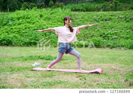 Yoga exercise stretching outdoor park middle-aged senior 127188899