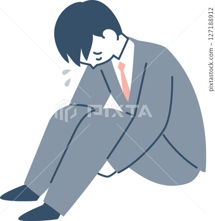 一位西裝革履的年輕男子低著頭坐著 一位西裝革履的年輕男子低著頭坐著 127188912