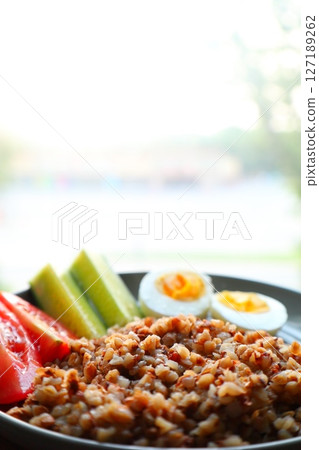 Buckwheat with boiled egg, cucumbers and tomatoes, breakfast Buckwheat with boiled egg, cucumbers and tomatoes, breakfast 127189262